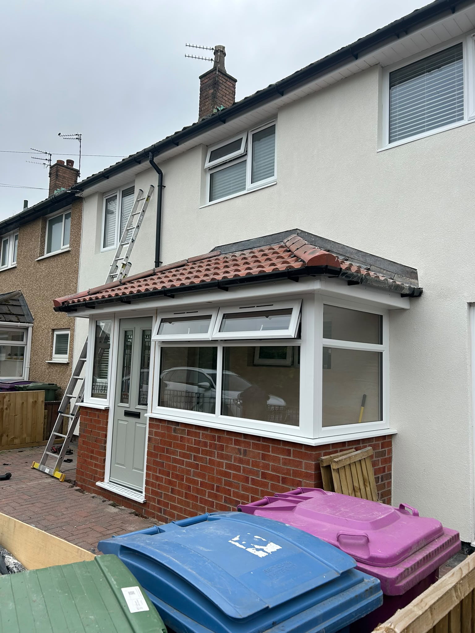 Brick porch with terracotta tiled roof