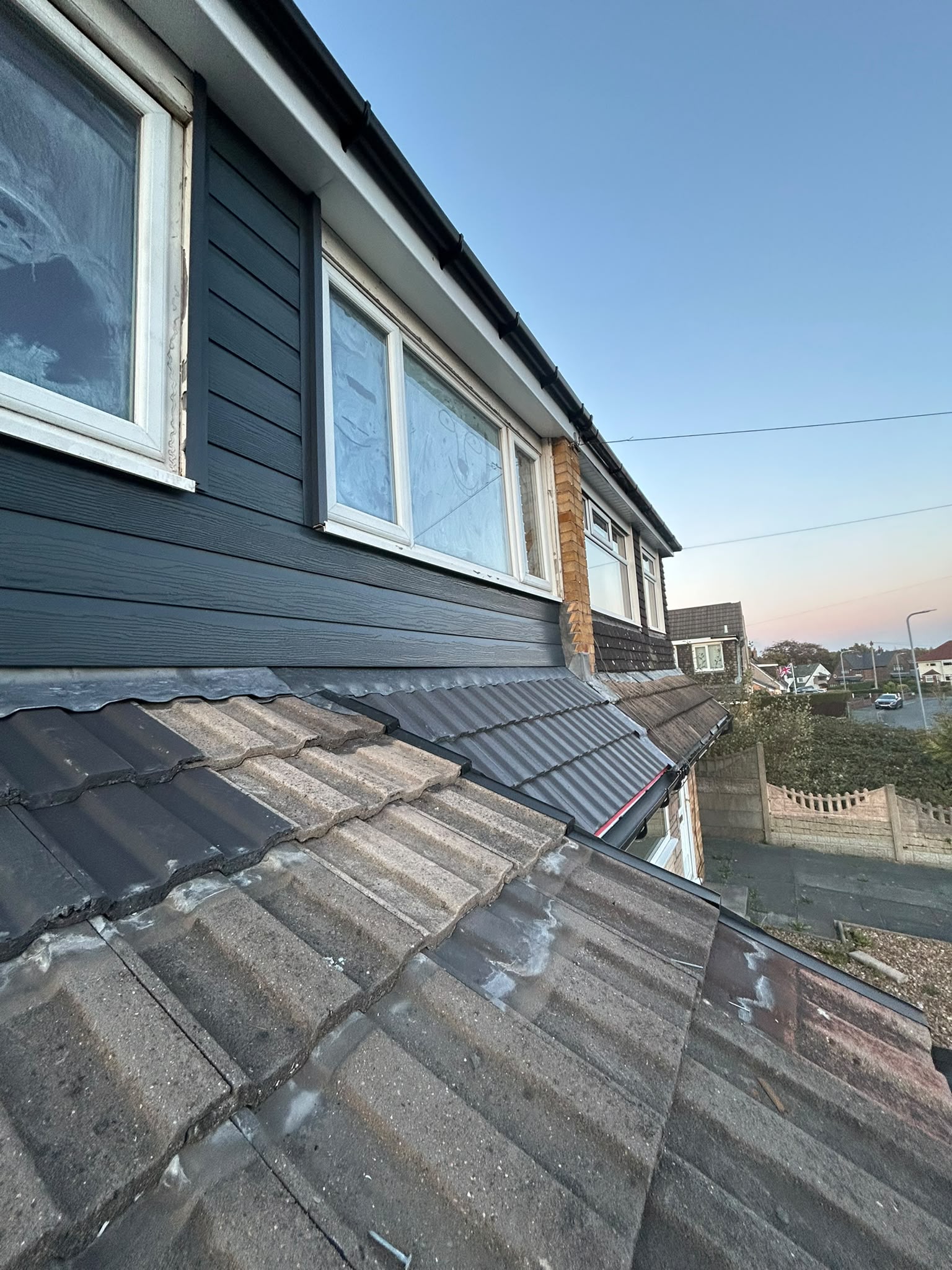 Dark dormer cladding with new grey roof tiles