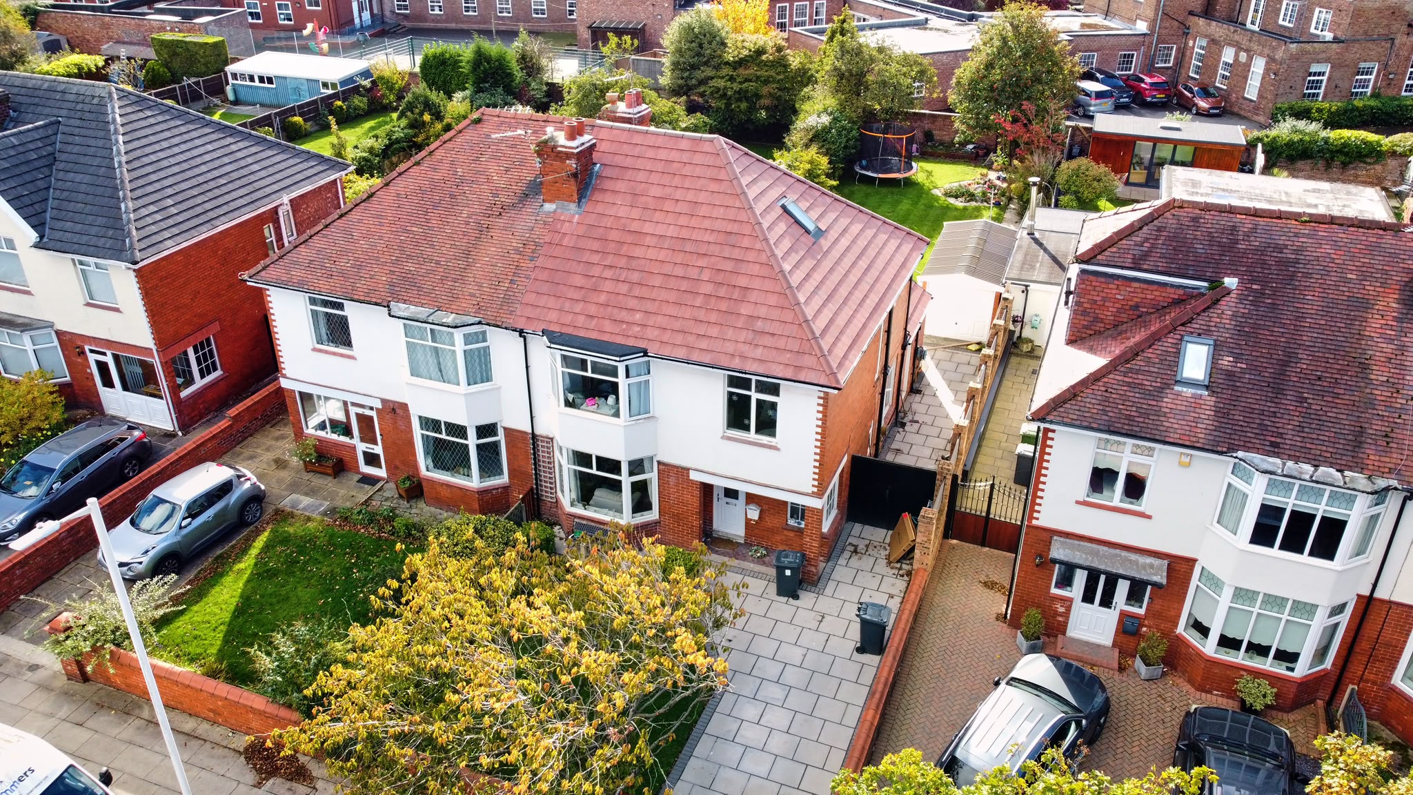 Aerial view of a semi-detached home with new clay tile roof